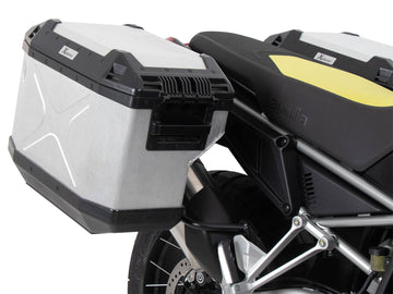 Aprilia Tuareg 660 [2022-2024] - Kofferträgerset Cutout schwarz inkl. Xplorer Cutout silber Kofferset